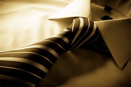 fashion corporate color - Tie cast shadows on the shirt tied knot, sepia Stock Photo - Budget Royalty-Free & Subscription, Code: 400-05721548
