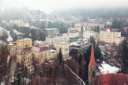 Aerial view down on Bad Gastein (Austria, Alps) town, mineral waters and ski resort and mountains in fog Stock Photo - Budget Royalty-Free & Subscription, Code: 400-05721684