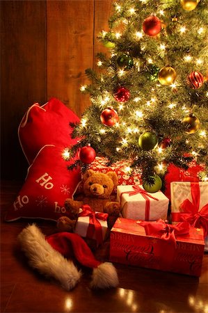 santa night - Closeup of brightly lit Christmas tree with gifts Stock Photo - Budget Royalty-Free & Subscription, Code: 400-05722853