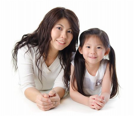 Asian mother and her daughter on white background Stock Photo - Budget Royalty-Free & Subscription, Code: 400-05722899