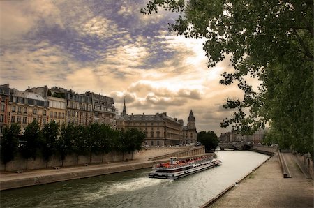 eine person - Touristic boat passing by Seine river along historical buildings in Paris, France Stock Photo - Budget Royalty-Free & Subscription, Code: 400-05734012