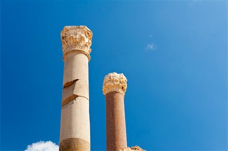 Two ancient roman pillars against a blue sky Stock Photo - Budget Royalty-Free & Subscription, Code: 400-05734030