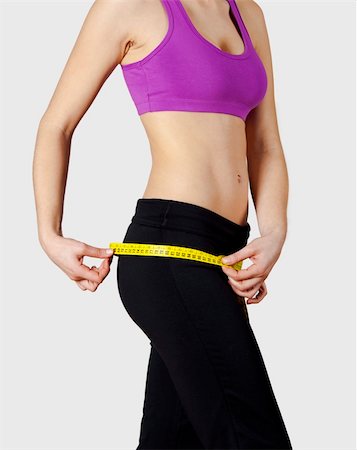 Athletic young women taking measurements of her own body - Healthy body concept Stock Photo - Budget Royalty-Free & Subscription, Code: 400-05734374