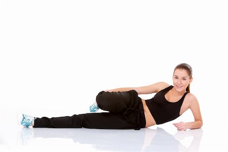 simsearch:400-04345817,k - Beautiful fitness woman doing stretching exercise on white Stockbilder - Microstock & Abonnement, Bildnummer: 400-05734519
