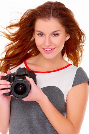 stylish woman snapshot - Cute young woman in gray dress with digtal camera on white Stock Photo - Budget Royalty-Free & Subscription, Code: 400-05734574