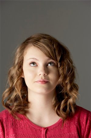simsearch:400-06105120,k - Studio Portrait Of Teenage Girl Looking Up Fotografie stock - Microstock e Abbonamento, Codice: 400-05734723