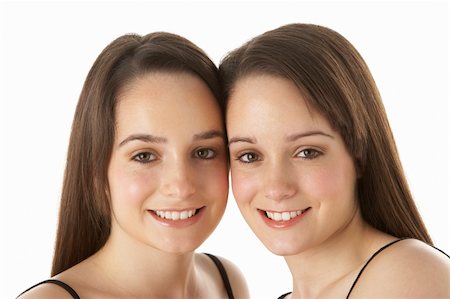 simsearch:400-05734883,k - Studio Portrait Of Teenage Twins Stock Photo - Budget Royalty-Free & Subscription, Code: 400-05734870