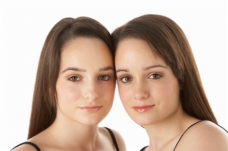 simsearch:400-05734883,k - Studio Portrait Of Teenage Twins Stock Photo - Budget Royalty-Free & Subscription, Code: 400-05734871