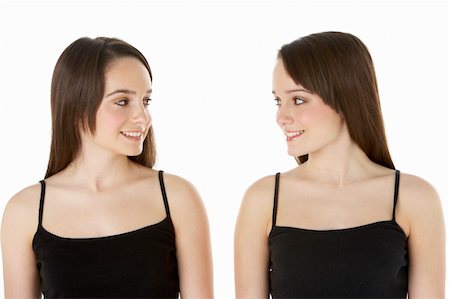 Studio Portrait Of Teenage Twins Stock Photo - Budget Royalty-Free & Subscription, Code: 400-05734880