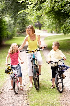 simsearch:400-04402100,k - Mother and children riding bikes in countryside Stock Photo - Budget Royalty-Free & Subscription, Code: 400-05735159