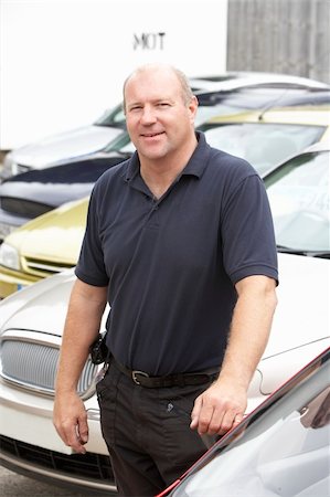 Car salesman standing on lot Stock Photo - Budget Royalty-Free & Subscription, Code: 400-05735226