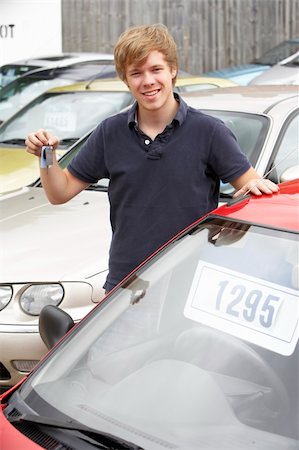 Young man collecting new car Stock Photo - Budget Royalty-Free & Subscription, Code: 400-05735230