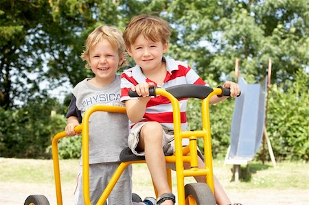 pictures of kids and friends playing at school - Two Young Boys Playing on Bike Stock Photo - Budget Royalty-Free & Subscription, Code: 400-05735256