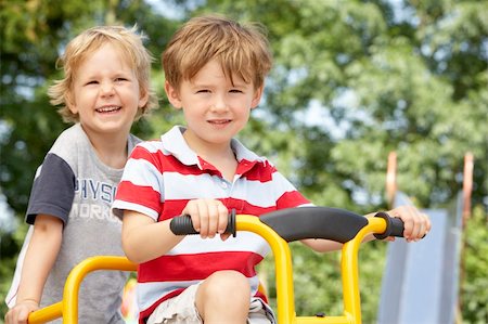 pictures of kids and friends playing at school - Two Young Boys Playing on Bike Stock Photo - Budget Royalty-Free & Subscription, Code: 400-05735257