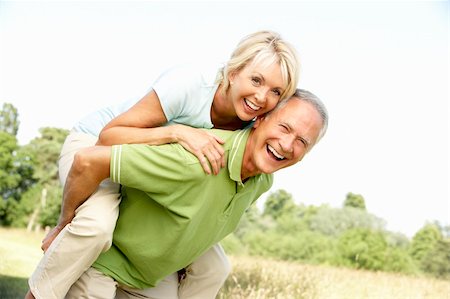 simsearch:400-05735475,k - Mature couple having fun in countryside Stock Photo - Budget Royalty-Free & Subscription, Code: 400-05735472
