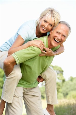 simsearch:400-05735475,k - Mature couple having fun in countryside Stock Photo - Budget Royalty-Free & Subscription, Code: 400-05735473