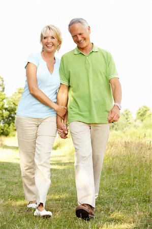 simsearch:400-05735475,k - Mature couple walking in countryside Stock Photo - Budget Royalty-Free & Subscription, Code: 400-05736033