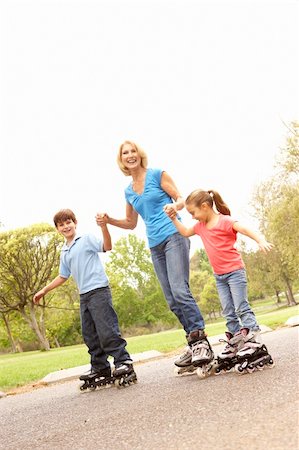 rollerblade girl - Grandmother And Grandchildren Skating In Park Stock Photo - Budget Royalty-Free & Subscription, Code: 400-05736223