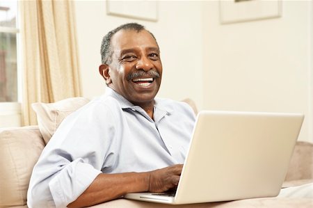 simsearch:400-04026722,k - Senior Man Using Laptop At Home Stock Photo - Budget Royalty-Free & Subscription, Code: 400-05736265