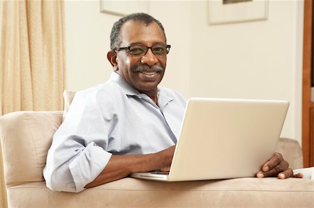 simsearch:400-05736257,k - Senior Man Using Laptop At Home Stock Photo - Budget Royalty-Free & Subscription, Code: 400-05736262