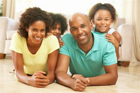 Family Relaxing At Home Together Stock Photo - Budget Royalty-Free & Subscription, Code: 400-05736349