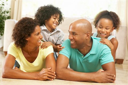 Family Relaxing At Home Together Stock Photo - Budget Royalty-Free & Subscription, Code: 400-05736350