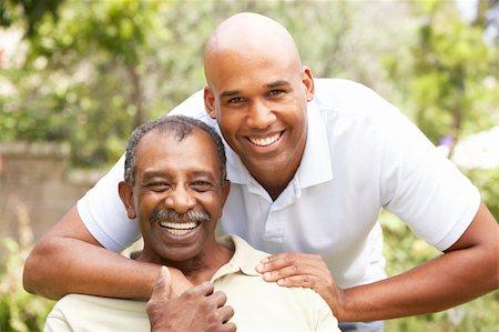 simsearch:400-05736257,k - Senior Man Hugging Adult Son Stock Photo - Budget Royalty-Free & Subscription, Code: 400-05736381