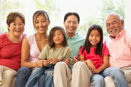 simsearch:400-06098367,k - Extended Family Relaxing On Sofa At Home Together Stock Photo - Budget Royalty-Free & Subscription, Code: 400-05736495