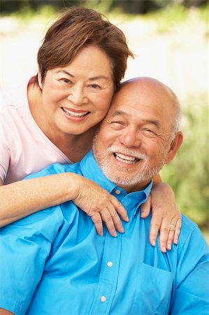 Senior Couple Relaxing In Garden Together Stock Photo - Budget Royalty-Free & Subscription, Code: 400-05736541