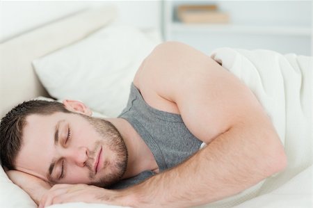 simsearch:400-08299475,k - Young man sleeping in his bedroom Stock Photo - Budget Royalty-Free & Subscription, Code: 400-05737245