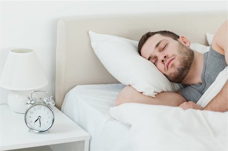 simsearch:400-08299475,k - Attractive man sleeping in his bedroom Stock Photo - Budget Royalty-Free & Subscription, Code: 400-05737249