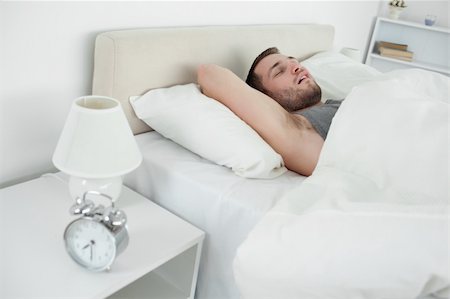 simsearch:400-08299475,k - Tired man sleeping in his bedroom Stock Photo - Budget Royalty-Free & Subscription, Code: 400-05737358