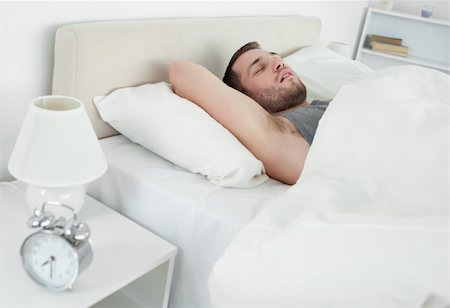 simsearch:400-05729351,k - Peaceful man sleeping in his bedroom Photographie de stock - Aubaine LD & Abonnement, Code: 400-05737359