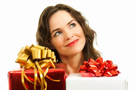 simsearch:400-05156727,k - Beautiful young woman choosing christmas presents. Isolated over white. Foto de stock - Super Valor sin royalties y Suscripción, Código: 400-05737402
