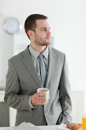 simsearch:400-04335708,k - Portrait of a young businessman having breakfast in his breakfast Stockbilder - Microstock & Abonnement, Bildnummer: 400-05737610