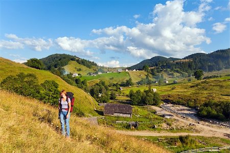 simsearch:400-05737744,k - Summer mountain village landscape and woman with tripod  in front Stock Photo - Budget Royalty-Free & Subscription, Code: 400-05737742