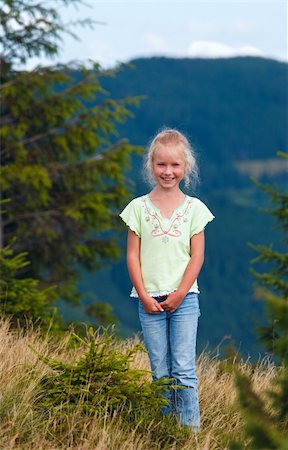simsearch:400-06063989,k - Small smiling girl in summer Carpathian mountain Foto de stock - Royalty-Free Super Valor e Assinatura, Número: 400-05737754