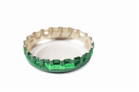 spin a bottle - Closeup view of green bottle cap isolated over white Stock Photo - Budget Royalty-Free & Subscription, Code: 400-05738778