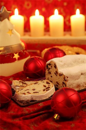 Christmas stollen with ornaments and candles on red background Stock Photo - Budget Royalty-Free & Subscription, Code: 400-05739123