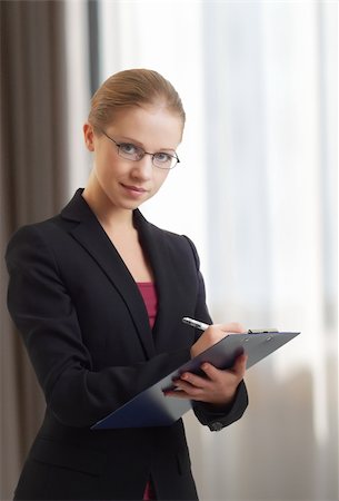 simsearch:400-06633122,k - Portrait of a beautiful young business woman with folder Stock Photo - Budget Royalty-Free & Subscription, Code: 400-05739189