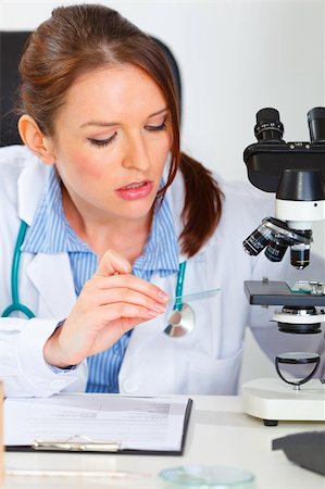 simsearch:400-07519214,k - Busy female medical doctor working sample in laboratory Stock Photo - Budget Royalty-Free & Subscription, Code: 400-05739359