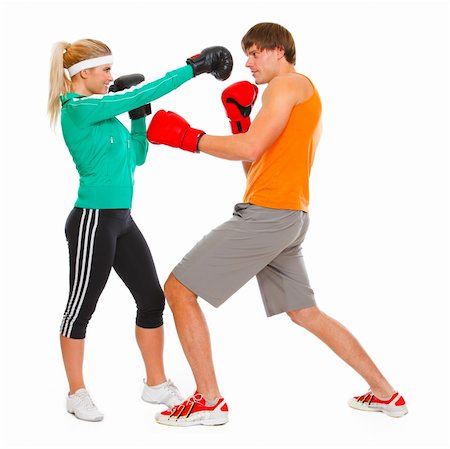 Male and female par in sportswear boxing isolated on white Stockbilder - Microstock & Abonnement, Bildnummer: 400-05739385