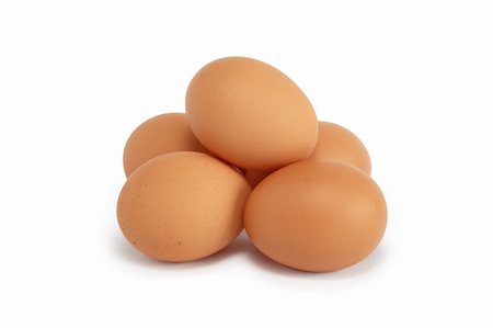 Small heap of raw eggs on white background. Isolated with clipping path Photographie de stock - Aubaine LD & Abonnement, Code: 400-05739410
