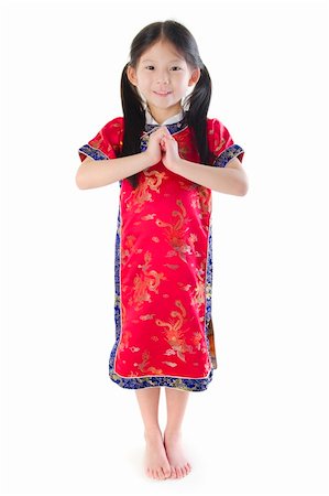 Little oriental girl wishing you a happy Chinese New Year Stock Photo - Budget Royalty-Free & Subscription, Code: 400-05739747