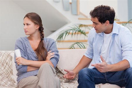 Man arguing with his wife in their living room Stock Photo - Budget Royalty-Free & Subscription, Code: 400-05739939