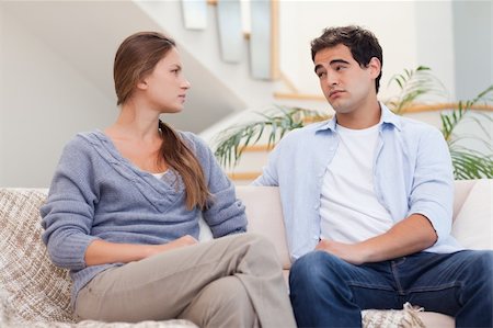 Young couple having an argument while watching TV in their living room Stock Photo - Budget Royalty-Free & Subscription, Code: 400-05739931