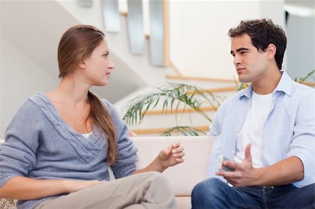 Couple having an argument in their living room Stock Photo - Budget Royalty-Free & Subscription, Code: 400-05739932