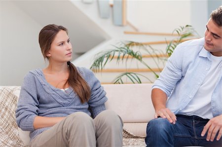 simsearch:400-05089878,k - Couple talking seriously in their living room Stock Photo - Budget Royalty-Free & Subscription, Code: 400-05739941