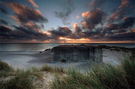 sea defence - German bunker at a coast in Denmark one morning with nice clouds Stock Photo - Budget Royalty-Free & Subscription, Code: 400-05730096