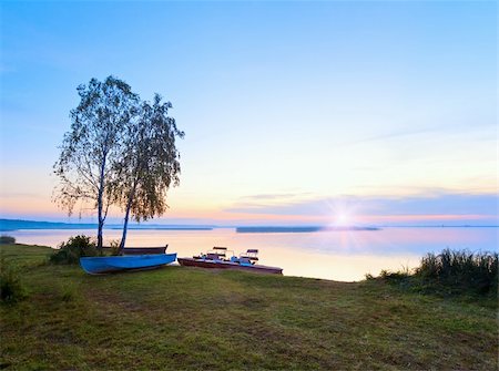 pedal boat - Sunset and old boats near the summer lake shore (Svityaz, Ukraine) Stock Photo - Budget Royalty-Free & Subscription, Code: 400-05730582